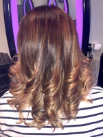 Caramel highlights finished with a curly blowdry